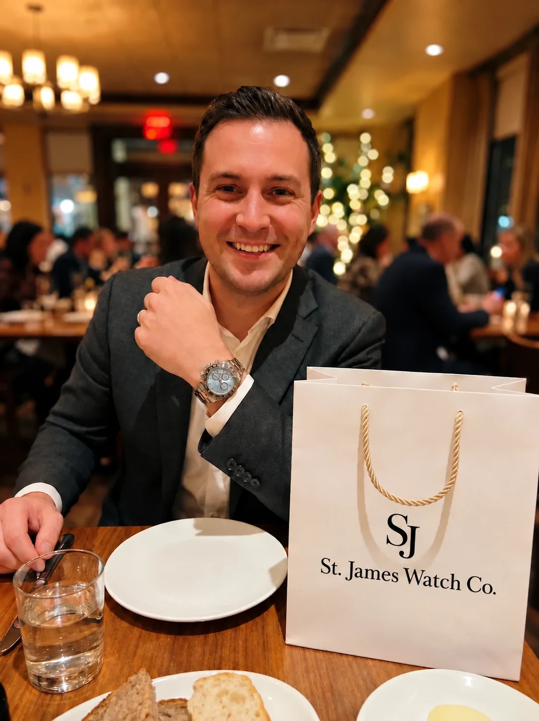 A customer wearing a watch with St. James Watch Co. packaging