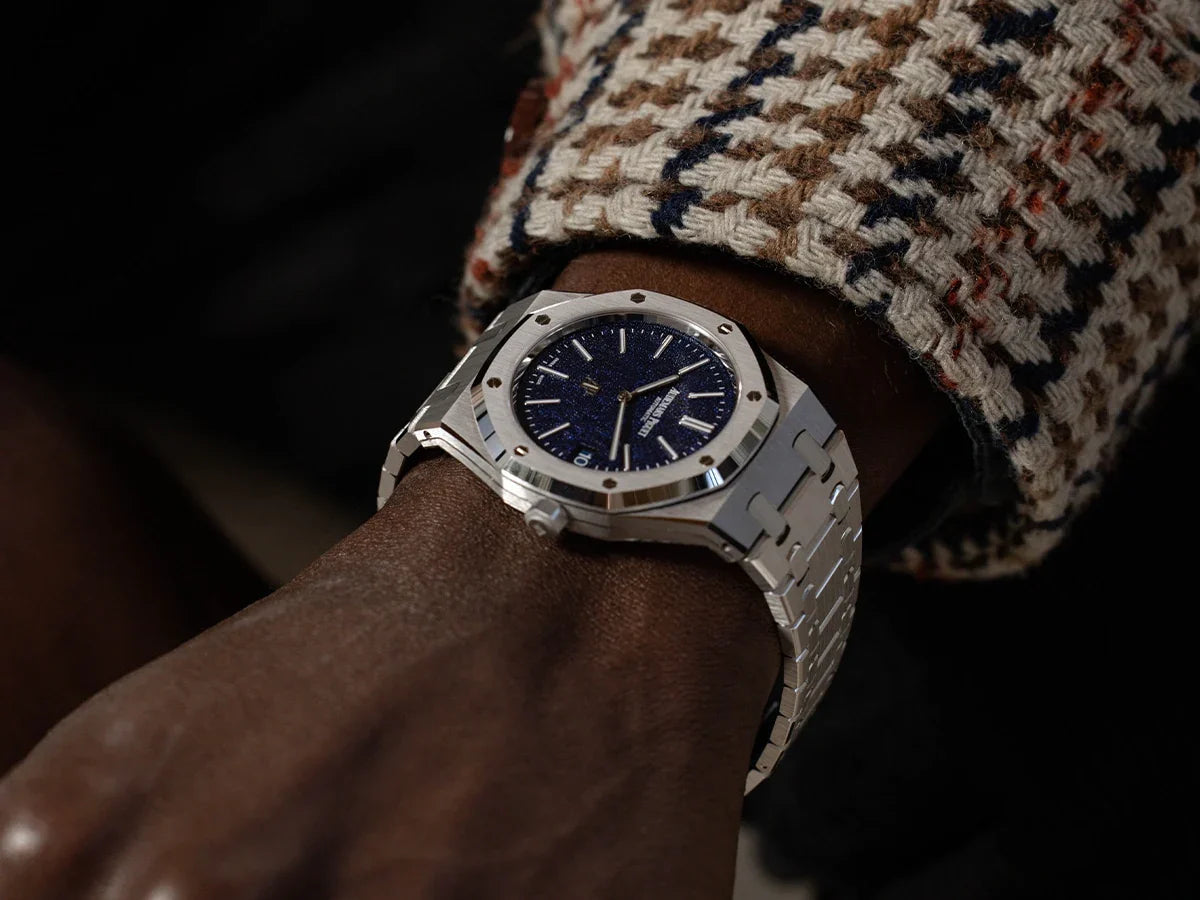 A timepiece worn with a textured jacket